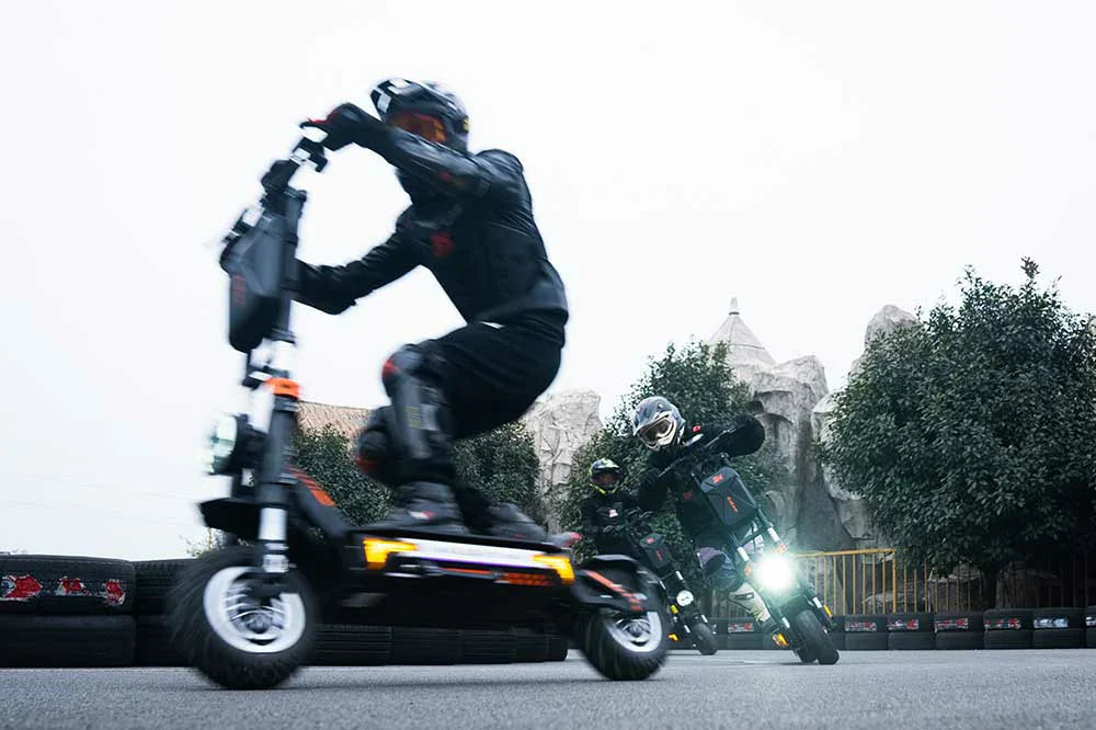 Rider on Kukirin G4 Max speeding down urban street at dusk.